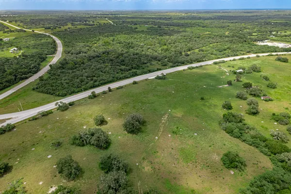 a view of a garden with a lake view