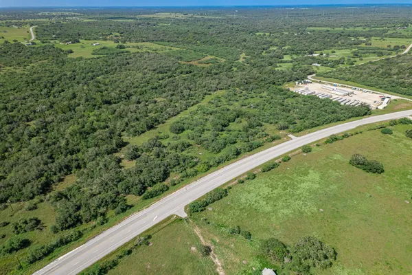 a view of a yard with an outdoor seating