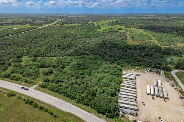 a view of a field with an outdoor space
