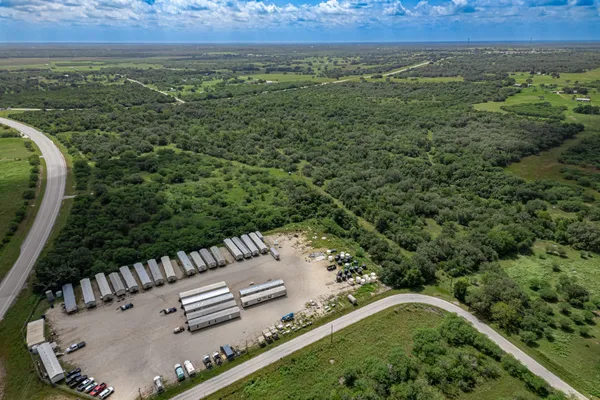 a view of a yard with an outdoor seating and yard