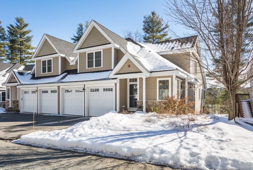 13 Trail Ridge Way, Unit D Harvard, MA 01451 - Photo 1 of 42 a front view of a house with a yard
