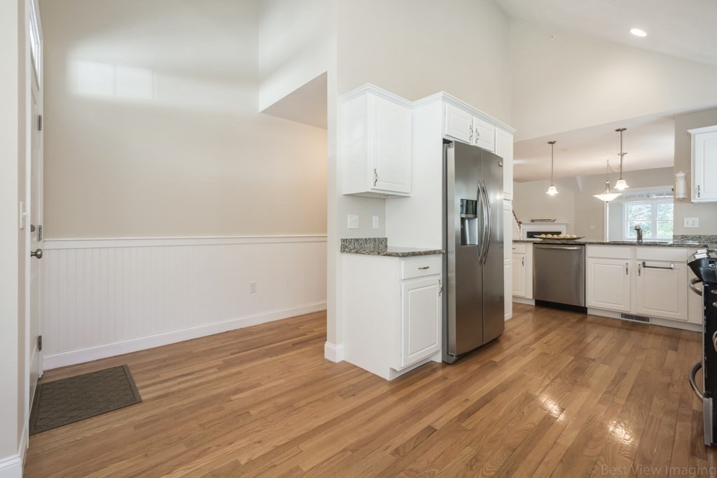 13 Trail Ridge Way, Unit D Harvard, MA 01451 - Photo 14 of 42 a kitchen with stainless steel appliances a refrigerator sink and microwave