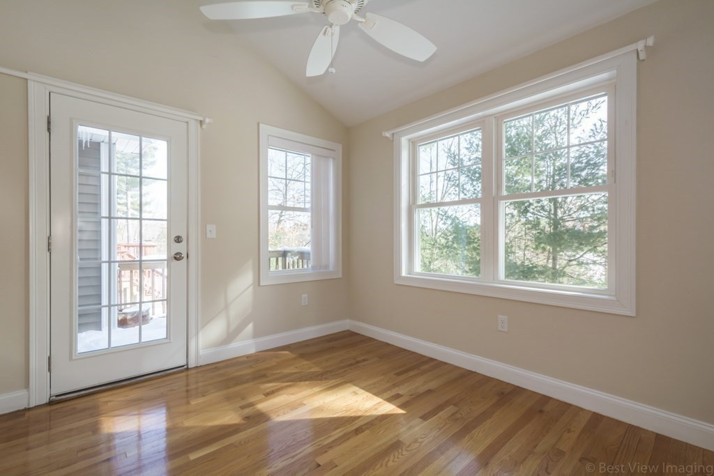 13 Trail Ridge Way, Unit D Harvard, MA 01451 - Photo 17 of 42 a view of an empty room with a window and wooden floor