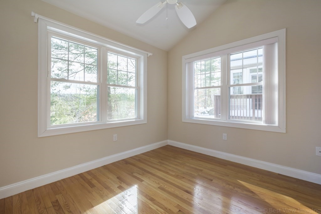 13 Trail Ridge Way, Unit D Harvard, MA 01451 - Photo 19 of 42 a view of an empty room with wooden floor and a window