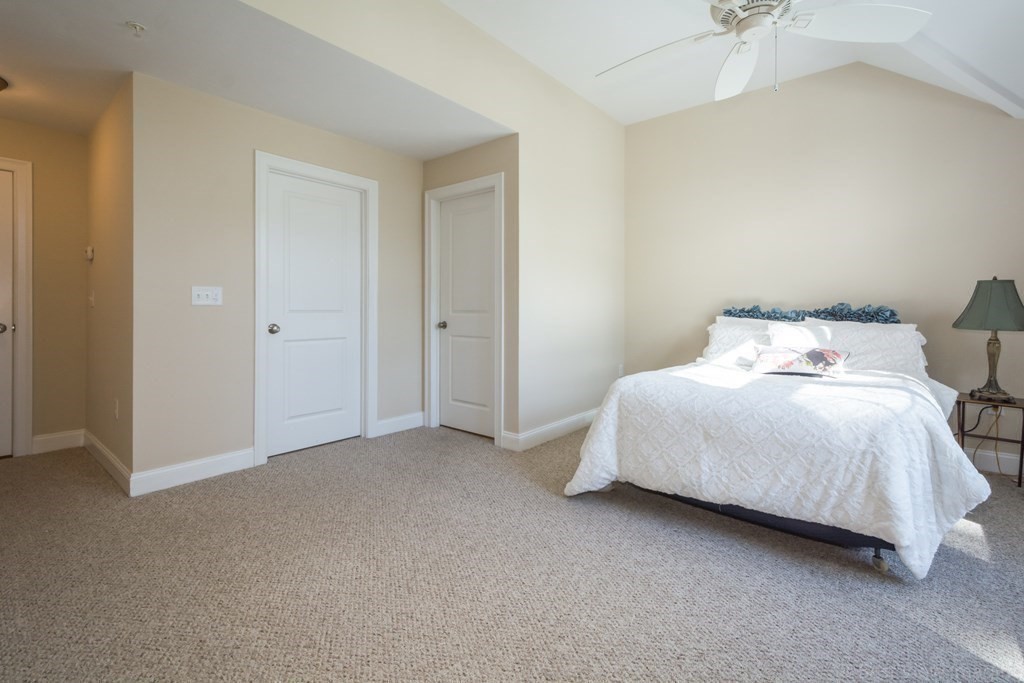 13 Trail Ridge Way, Unit D Harvard, MA 01451 - Photo 21 of 42 a bedroom with a bed and a ceiling fan