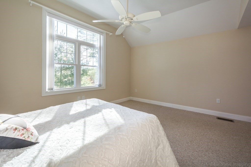 13 Trail Ridge Way, Unit D Harvard, MA 01451 - Photo 22 of 42 a bedroom with a bed and a window