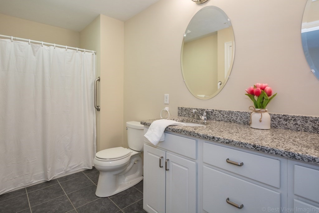 13 Trail Ridge Way, Unit D Harvard, MA 01451 - Photo 23 of 42 a bathroom with a granite countertop sink and a mirror