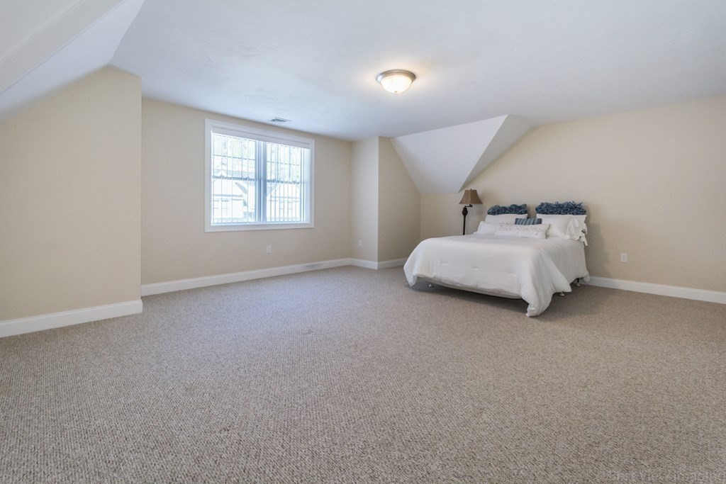 13 Trail Ridge Way, Unit D Harvard, MA 01451 - Photo 24 of 42 a room with a bed and window