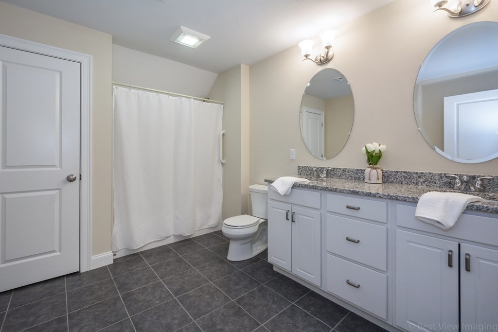 13 Trail Ridge Way, Unit D Harvard, MA 01451 - Photo 27 of 42 a bathroom with a double vanity sink and a mirror