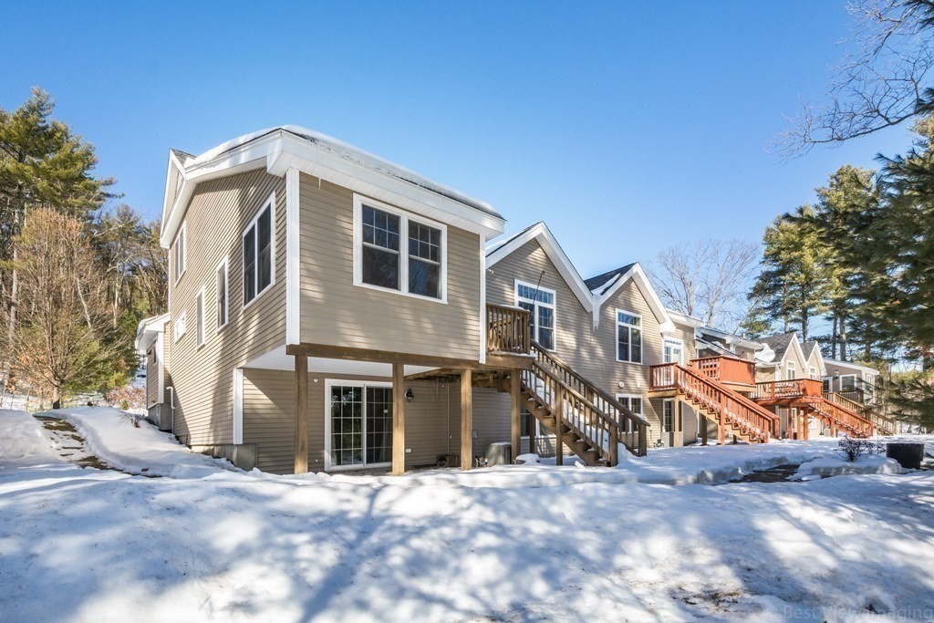 13 Trail Ridge Way, Unit D Harvard, MA 01451 - Photo 38 of 42 a view of a house with a yard