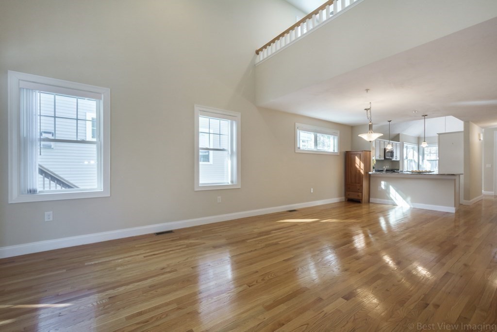 13 Trail Ridge Way, Unit D Harvard, MA 01451 - Photo 7 of 42 a view of an empty room with kitchen and window