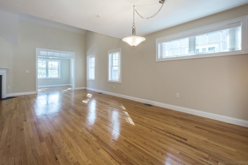 13 Trail Ridge Way, Unit D Harvard, MA 01451 - Photo 8 of 42 a view of an empty room with wooden floor and a window