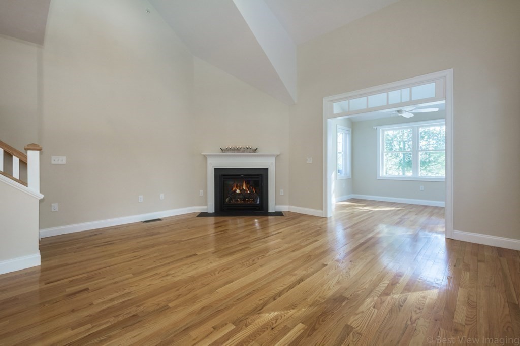 13 Trail Ridge Way, Unit D Harvard, MA 01451 - Photo 9 of 42 a view of an empty room with wooden floor and a window
