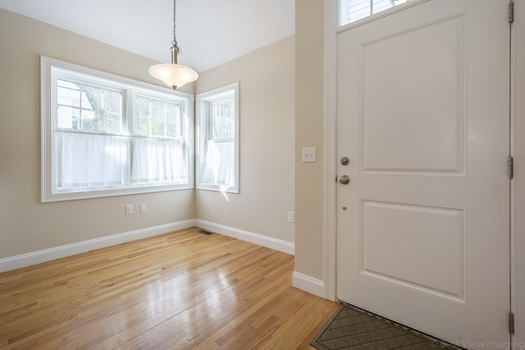 13 Trail Ridge Way, Unit D Harvard, MA 01451 - Photo 10 of 42 a view of empty room with wooden floor and fan