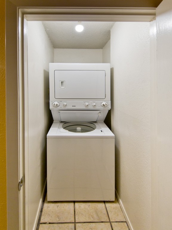 3839 Dry Creek Drive, Unit 220 Austin, TX 78731 - Photo 19 of 26 a utility room with dryer and washer