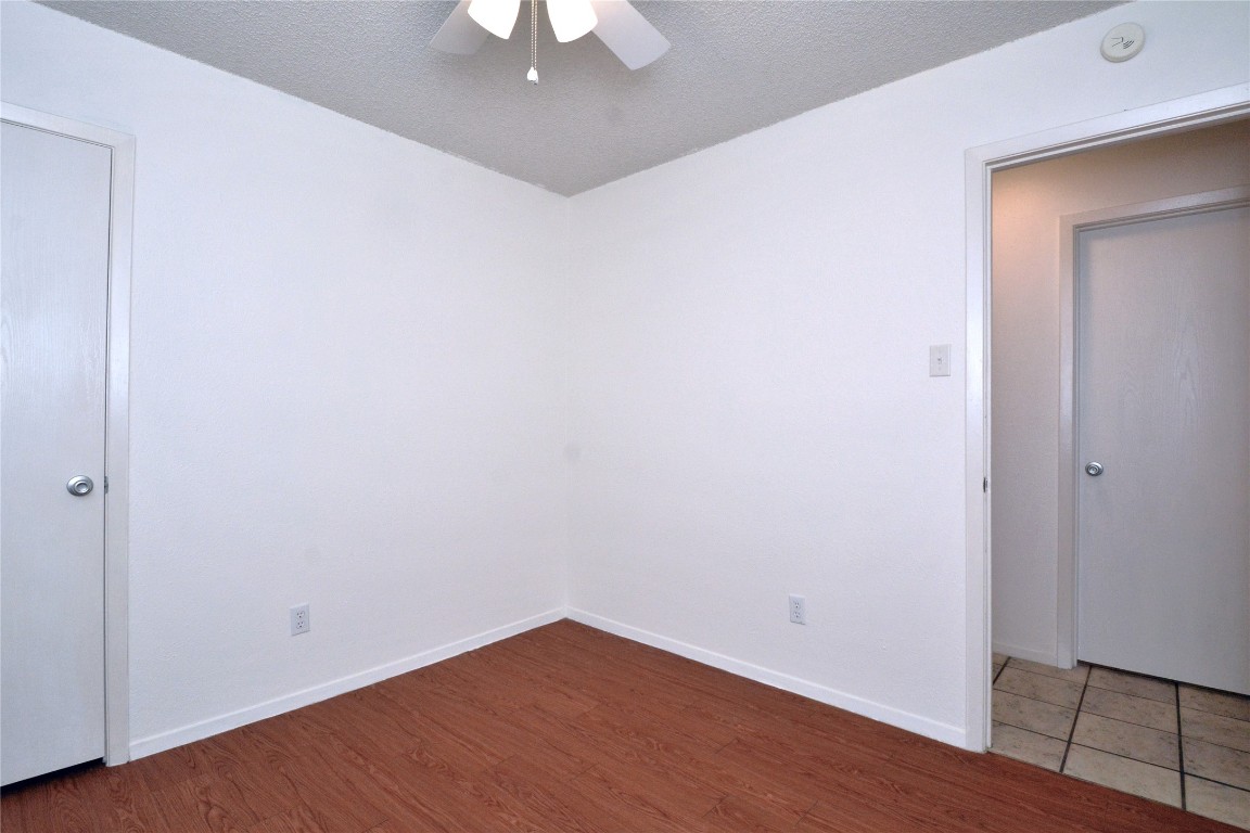 3839 Dry Creek Drive, Unit 220 Austin, TX 78731 - Photo 10 of 26 an empty room with wooden floor and closet