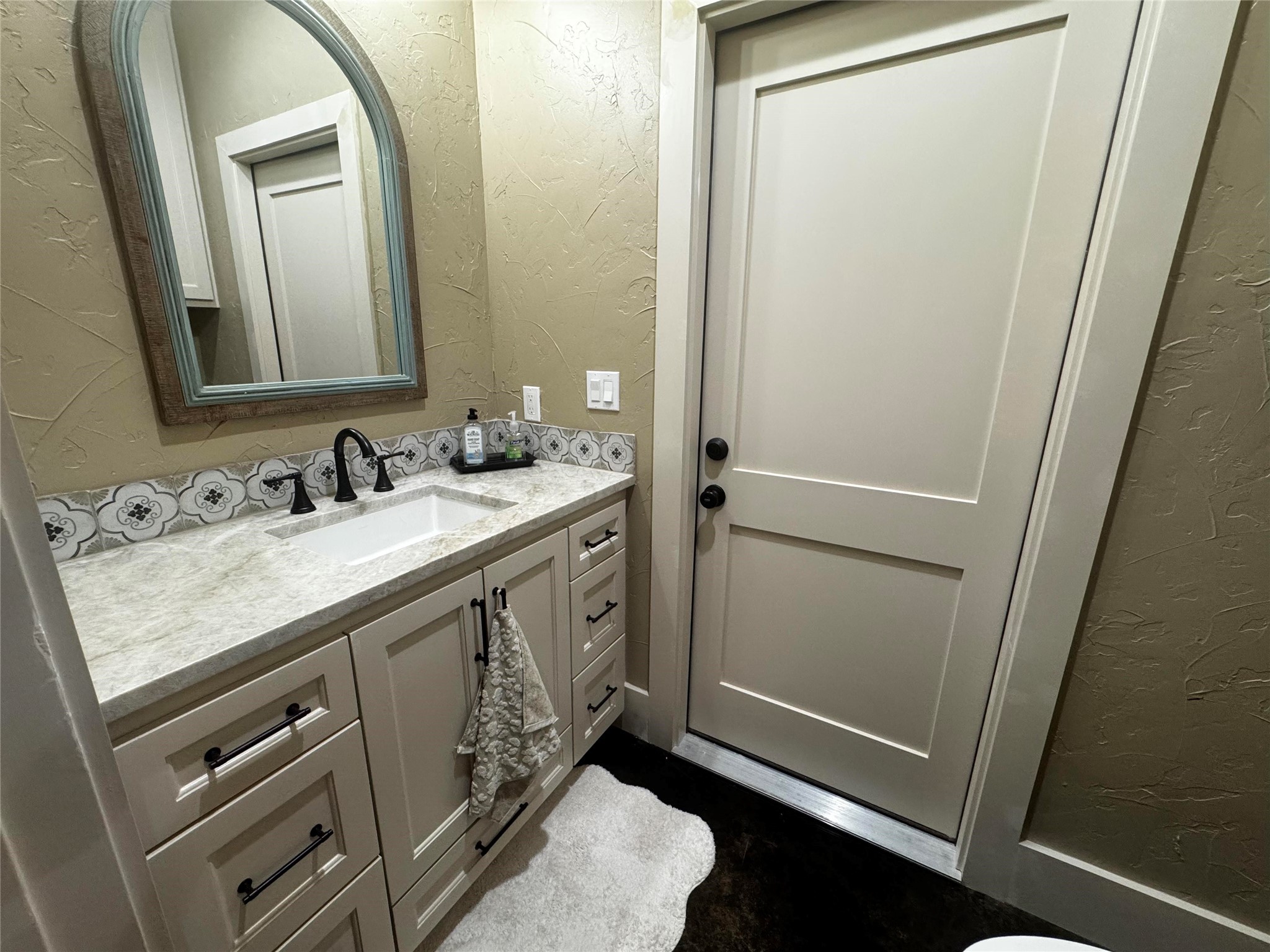 72 Circle Hook Port Port O'Connor, TX 77982 - Photo 15 of 43 a bathroom with a sink a mirror and a vanity