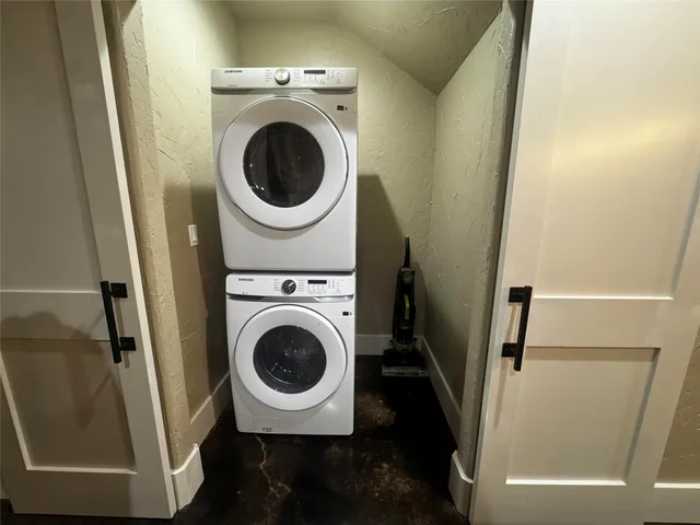 a utility room with sink washer and dryer