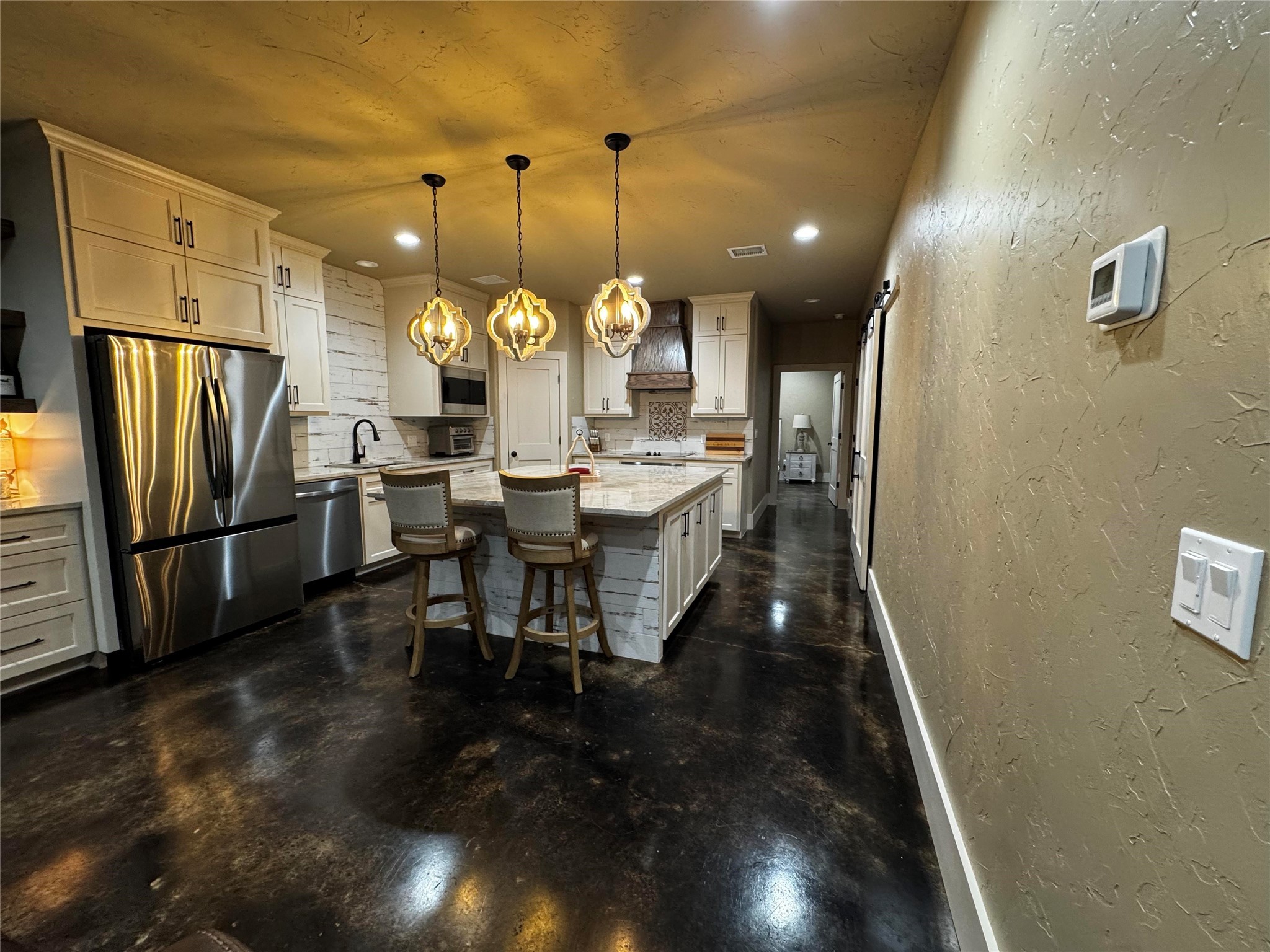 72 Circle Hook Port Port O'Connor, TX 77982 - Photo 18 of 43 a dining room with stainless steel appliances furniture a rug and a kitchen view
