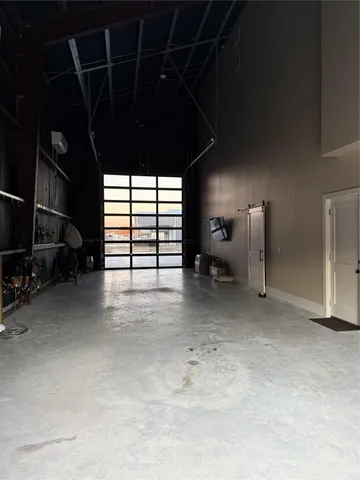 a view of water heater room with windows