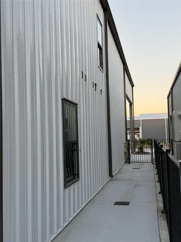 a view of a hallway with seating space
