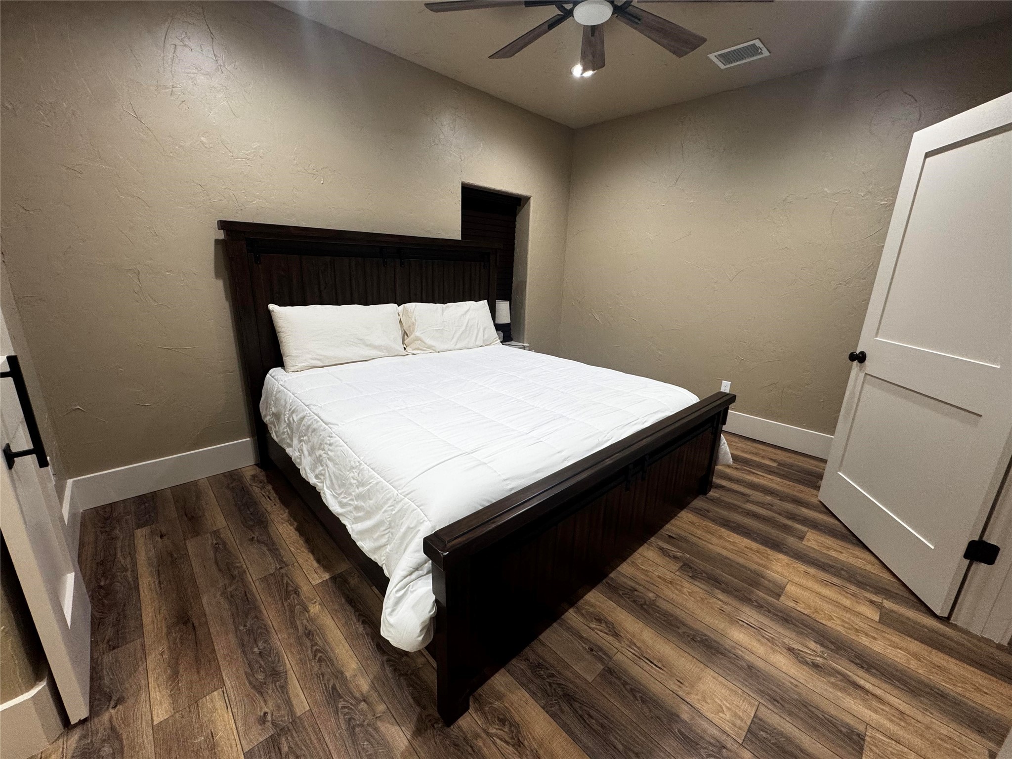 72 Circle Hook Port Port O'Connor, TX 77982 - Photo 26 of 43 a large bed sitting in a bedroom next to a window