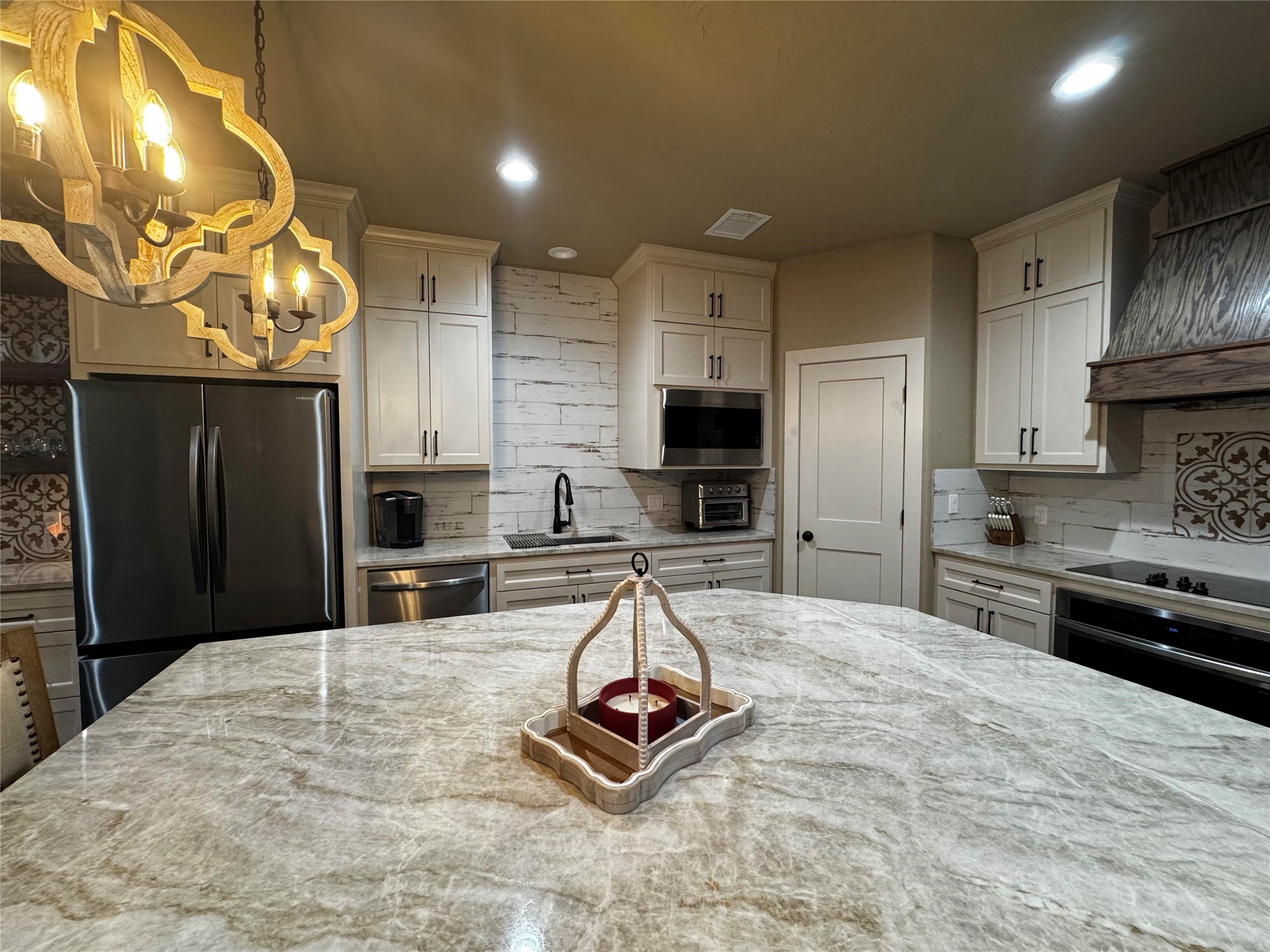 72 Circle Hook Port Port O'Connor, TX 77982 - Photo 6 of 43 a kitchen with kitchen island granite countertop a stove refrigerator and cabinets