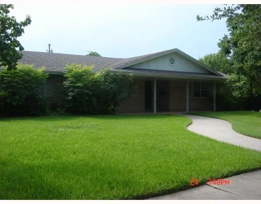 a view of a house with a garden