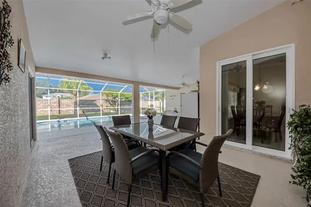 an outdoor space with swimming pool and furniture