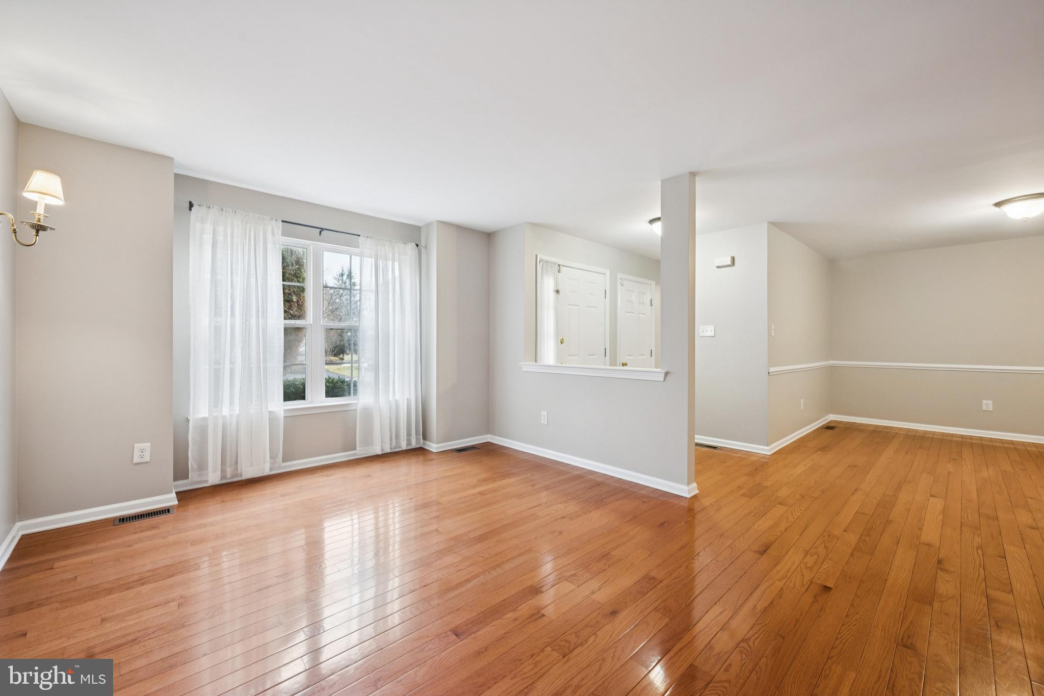 16 Hogan Way Moorestown, NJ 08057 - Photo 5 of 25 an empty room with wooden floor and windows