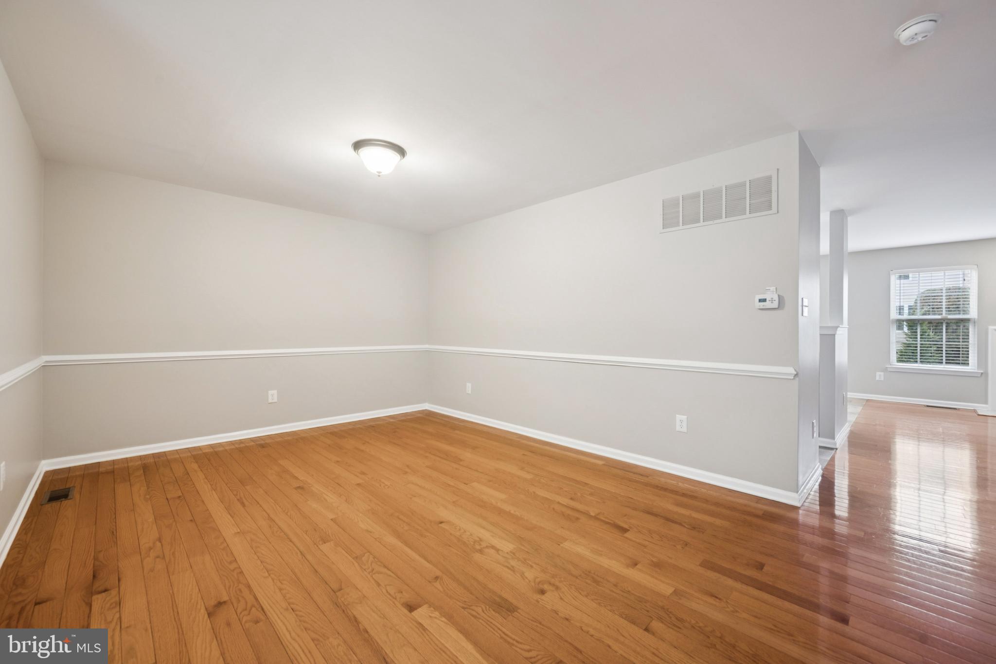 16 Hogan Way Moorestown, NJ 08057 - Photo 6 of 25 wooden floor in an empty room with a window