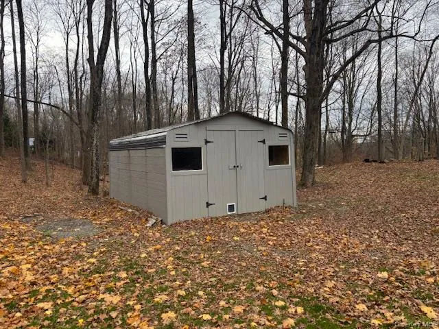 a view of a house with a large tree