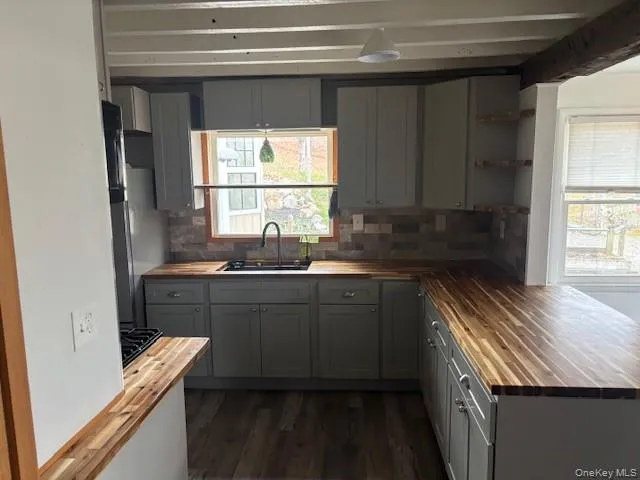 a kitchen with a sink and a window