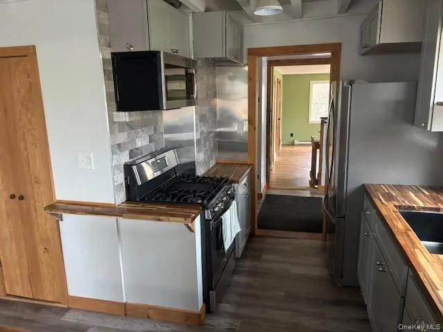 a kitchen with a stove and a refrigerator