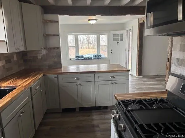 a kitchen with a stove and a sink