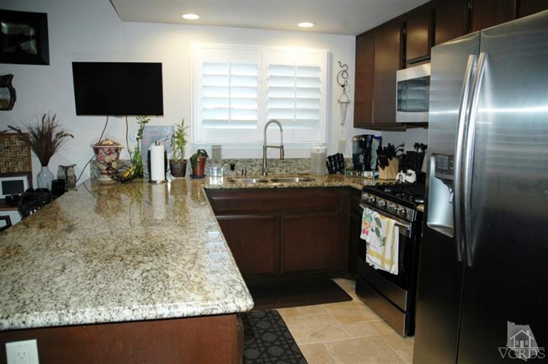 4783 Talmadge Road Moorpark, CA 93021 - Photo 14 of 25 a kitchen with sink and refrigerator