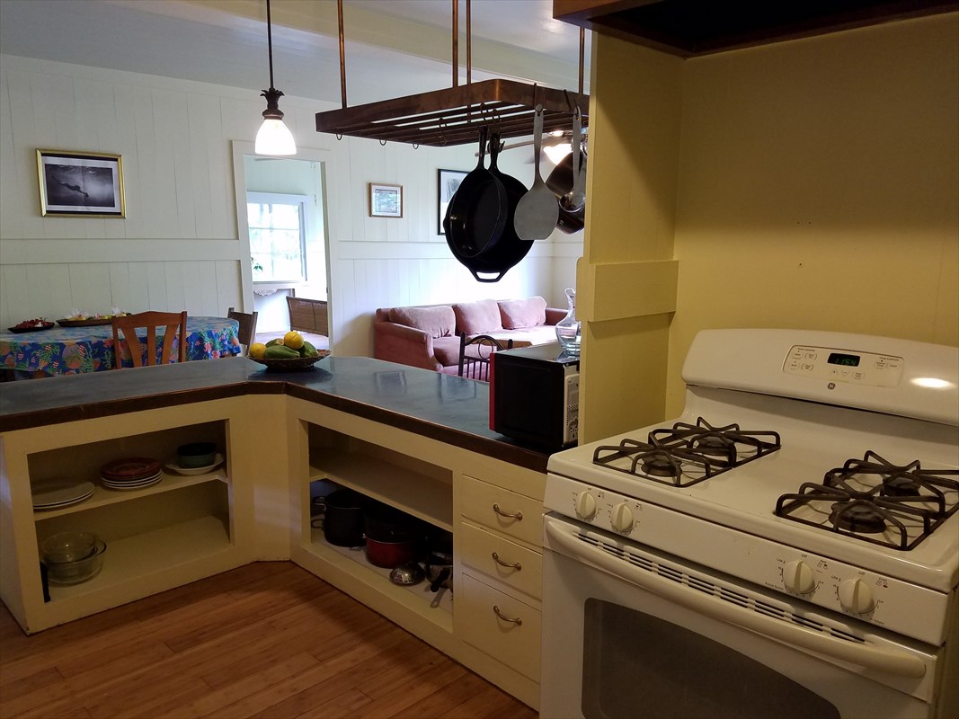 87-3460 Hawaii Belt Road Captain Cook, HI 96704 - Photo 15 of 25 a kitchen with a stove and a microwave