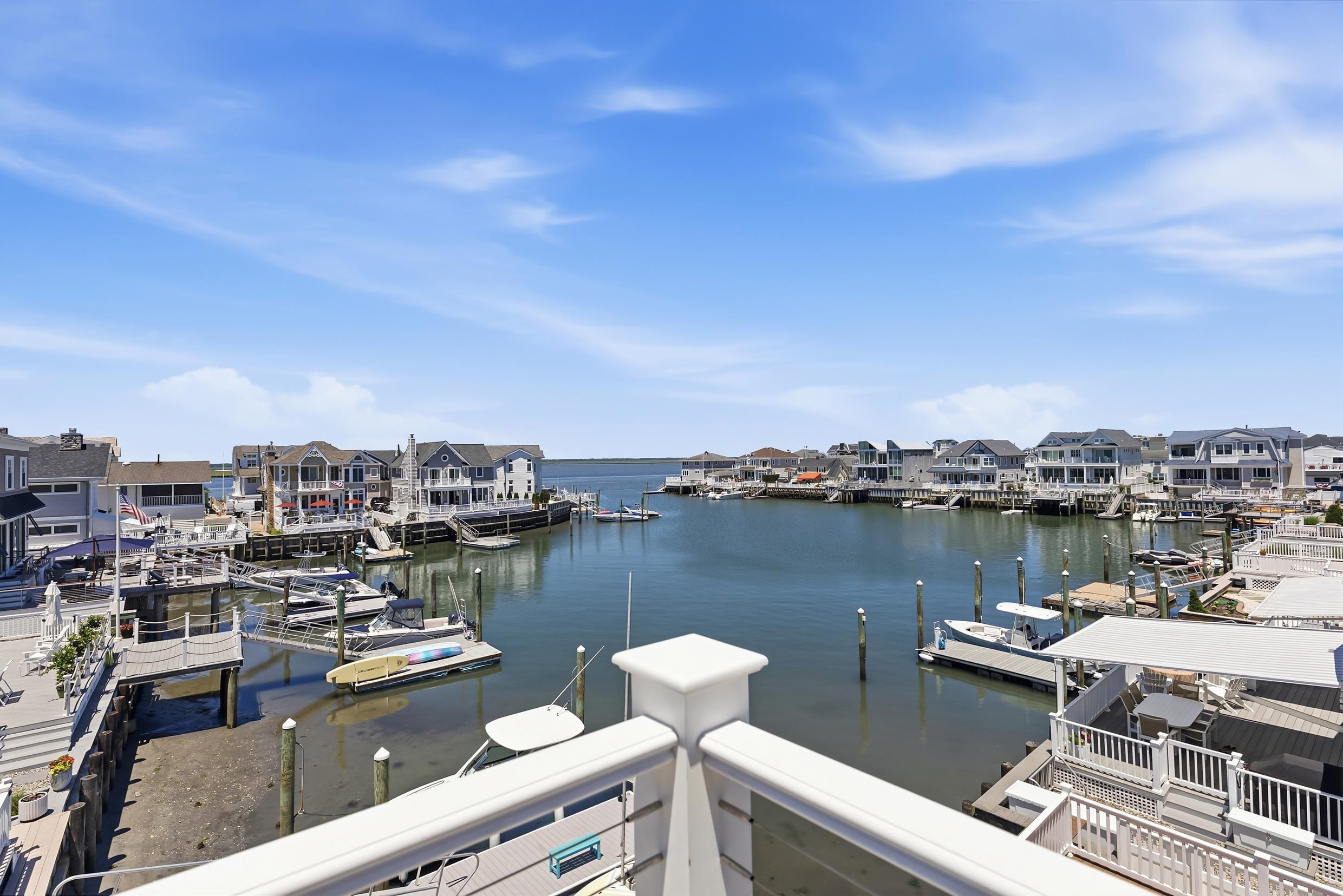 8527 3rd Stone Harbor, NJ 08247 - Photo 22 of 28 a view of a lake with a table and chairs