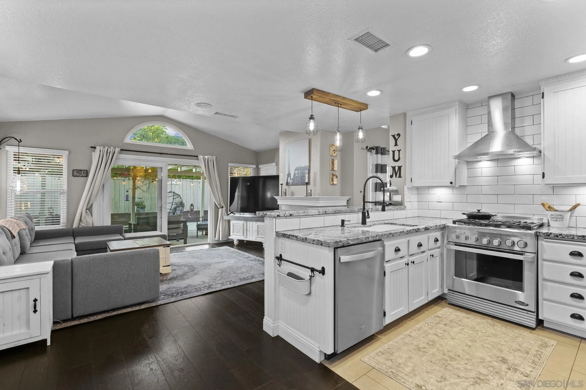 1846 Corte Pulsera Oceanside, CA 92056 - Photo 13 of 30 a large kitchen with stainless steel appliances granite countertop a stove and a sink