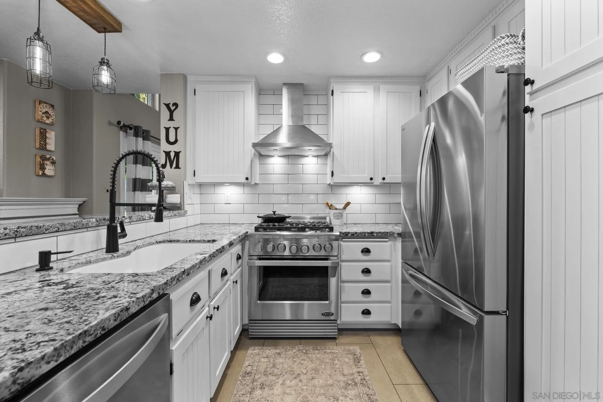 1846 Corte Pulsera Oceanside, CA 92056 - Photo 14 of 30 a kitchen with stainless steel appliances granite countertop a sink stove and refrigerator