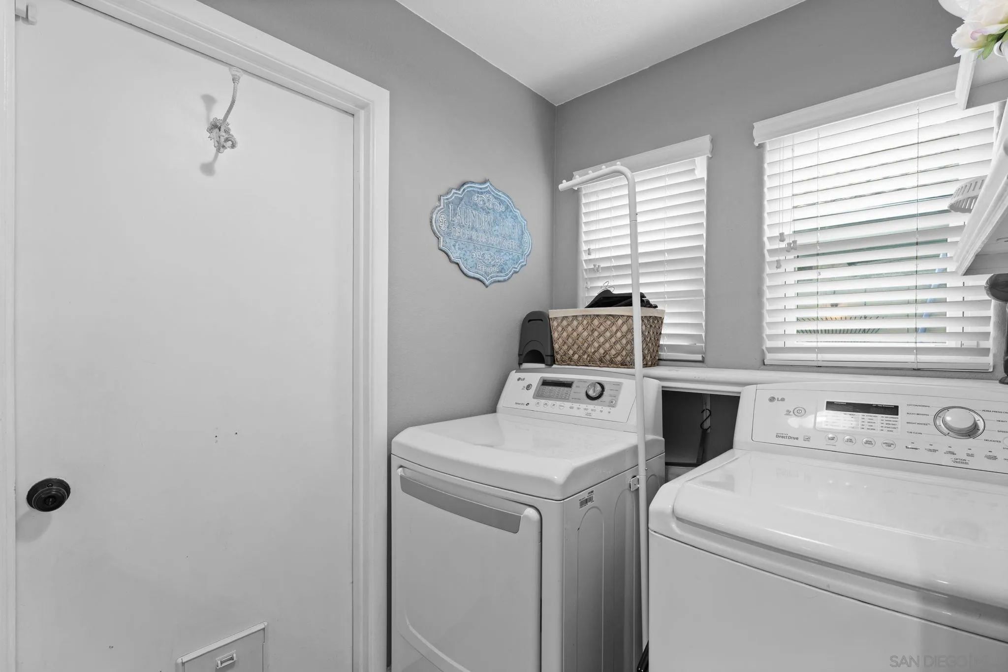 1846 Corte Pulsera Oceanside, CA 92056 - Photo 24 of 30 a view of washer and dryer with bathroom in the background