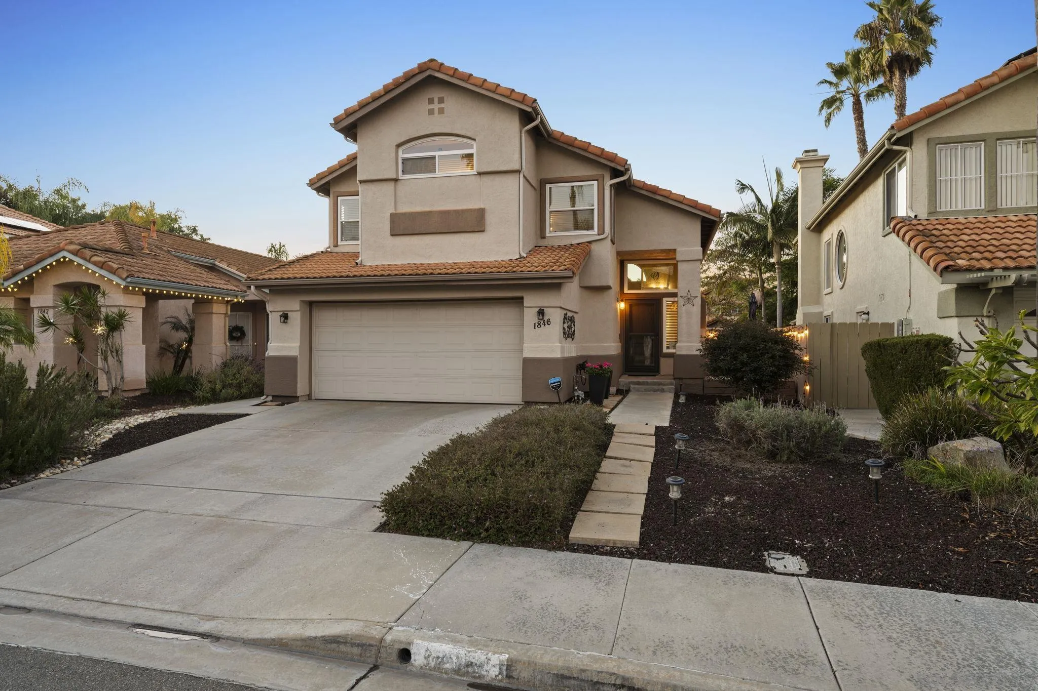 1846 Corte Pulsera Oceanside, CA 92056 - Photo 25 of 30 a front view of a house with a yard
