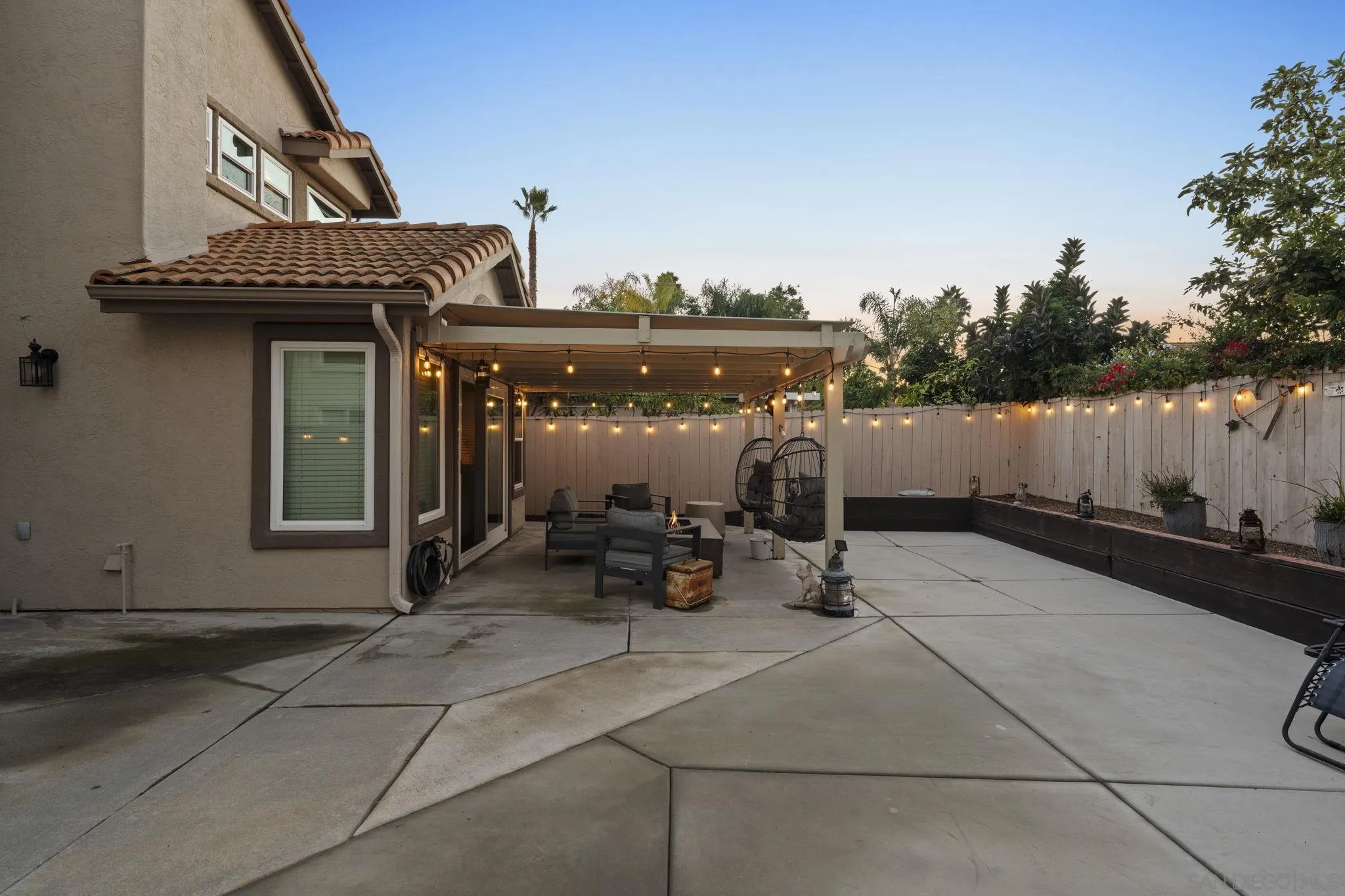 1846 Corte Pulsera Oceanside, CA 92056 - Photo 29 of 30 a view of a patio with table and chairs and potted plants