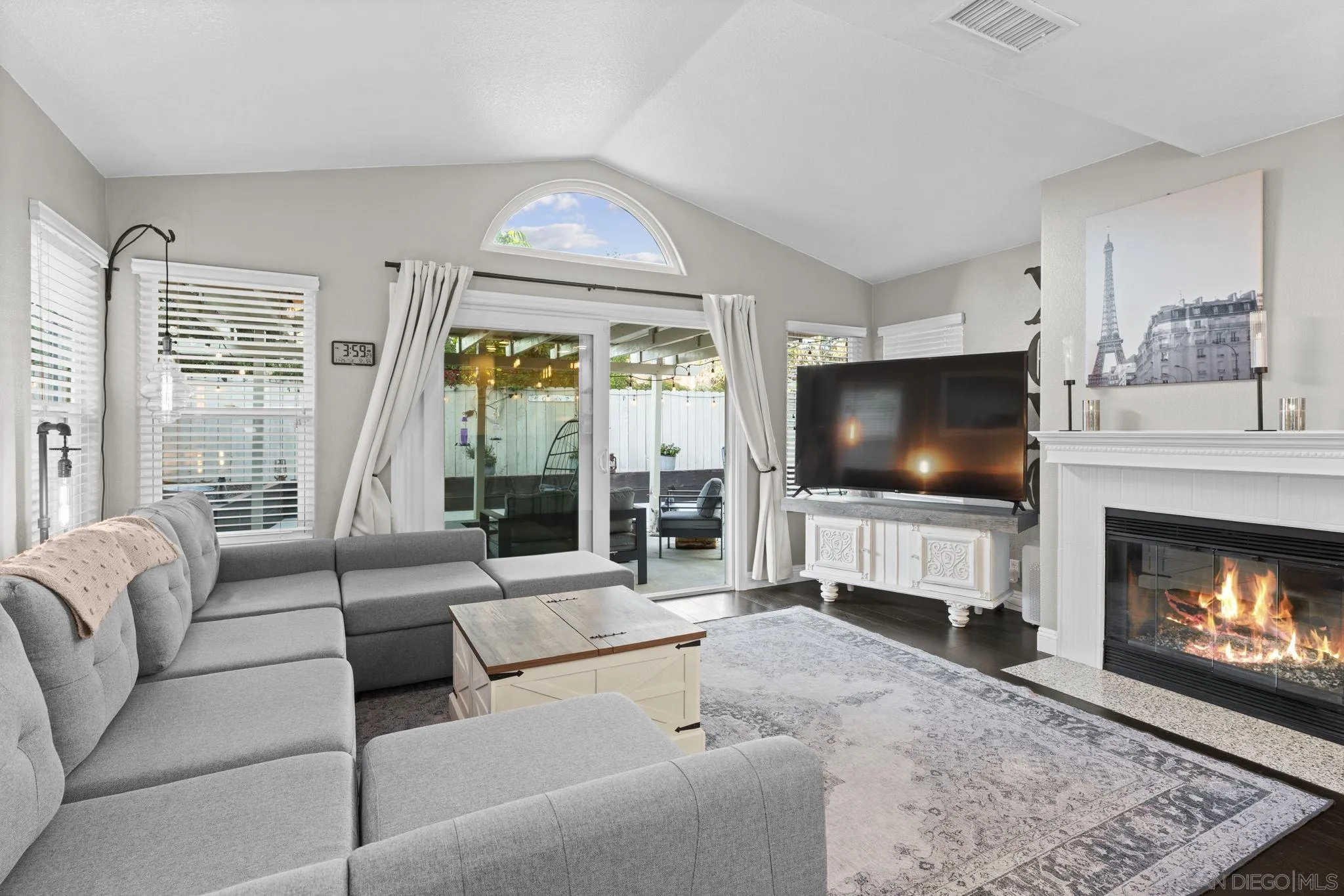 1846 Corte Pulsera Oceanside, CA 92056 - Photo 10 of 30 a living room with furniture a flat screen tv and a fireplace