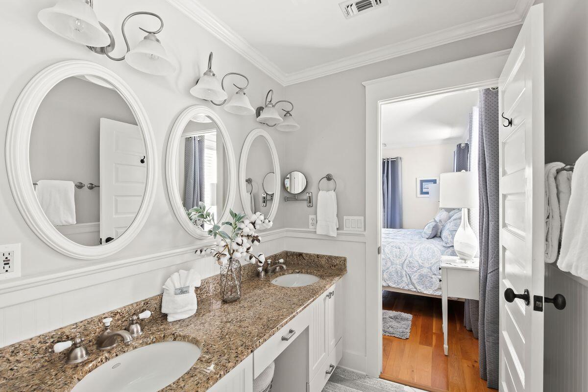 43 Sand Flea Drive Inlet Beach, FL 32461 - Photo 11 of 49 a bathroom with a granite countertop sink a mirror and vanity