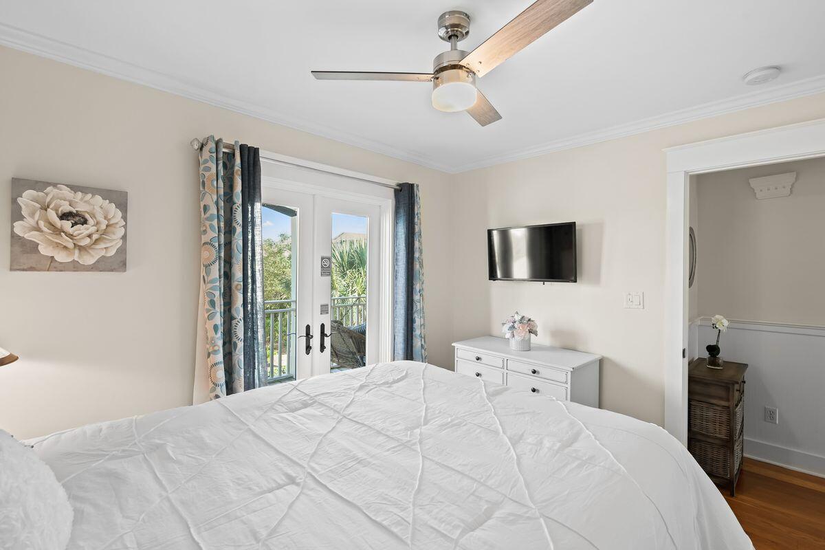 43 Sand Flea Drive Inlet Beach, FL 32461 - Photo 13 of 49 a bedroom with a bed and a flat tv screen on the dresser