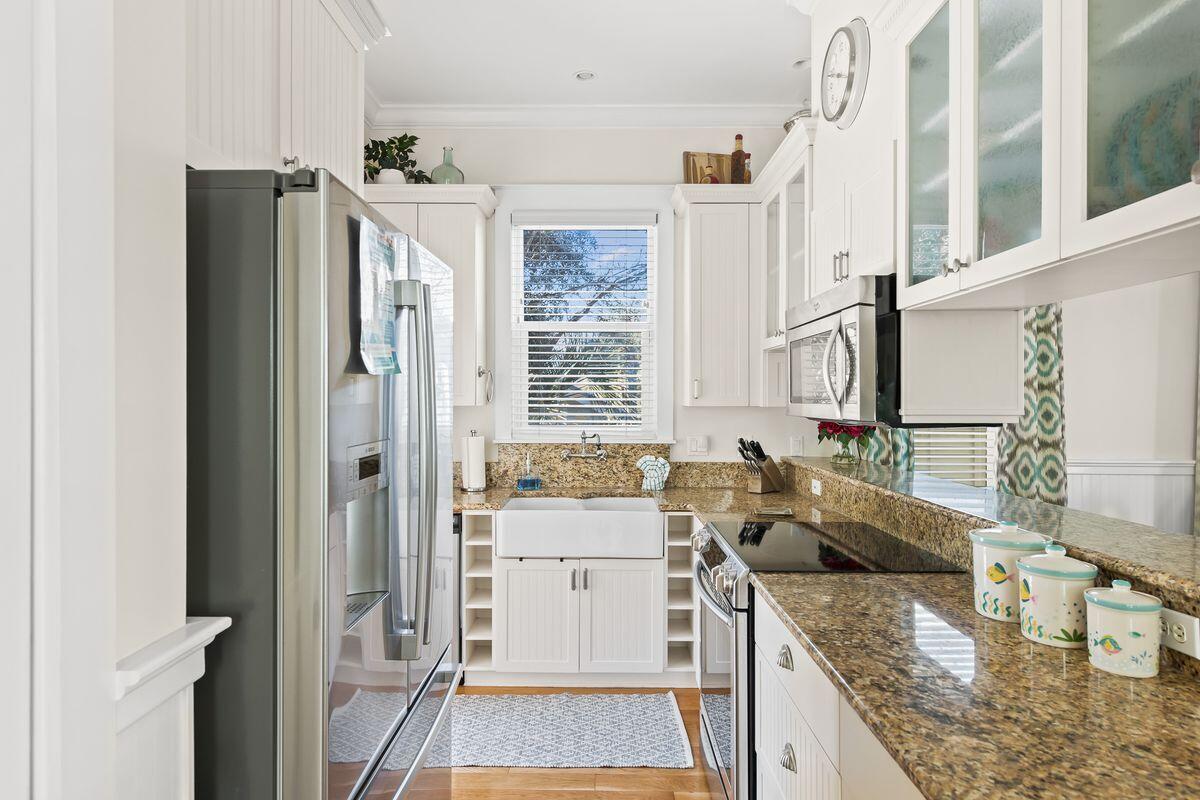 43 Sand Flea Drive Inlet Beach, FL 32461 - Photo 29 of 49 a kitchen with stainless steel appliances granite countertop a refrigerator and a sink