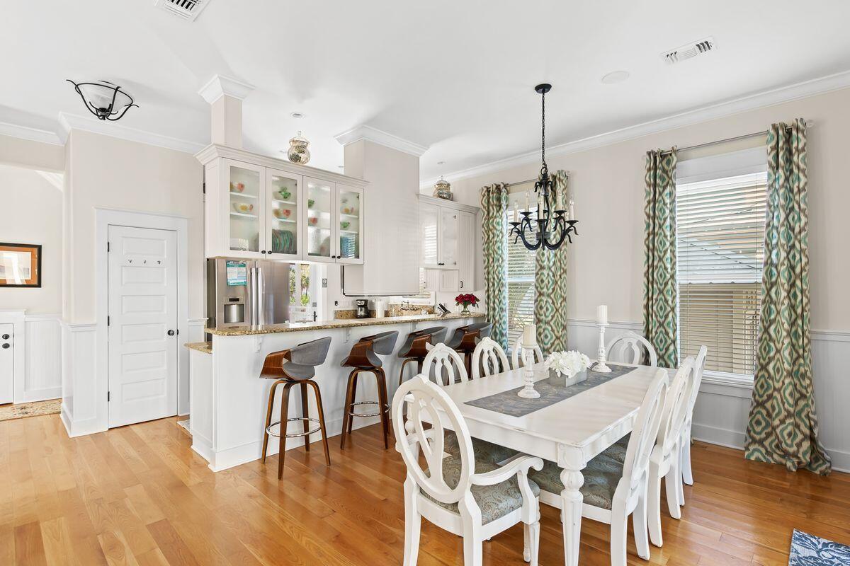 43 Sand Flea Drive Inlet Beach, FL 32461 - Photo 3 of 49 a view of a a dining room with furniture window and wooden floor