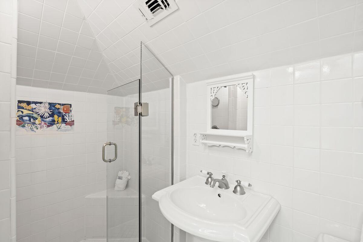 43 Sand Flea Drive Inlet Beach, FL 32461 - Photo 31 of 49 a bathroom with a sink and mirror