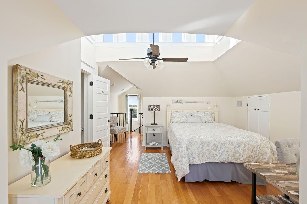 43 Sand Flea Drive Inlet Beach, FL 32461 - Photo 38 of 49 a bedroom with a bed and a chandelier
